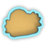 a cookie cutter with a cookie in the shape of a cookie