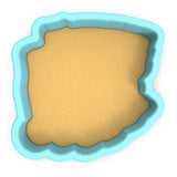 a cookie cutter with a cookie in the shape of a rectangle