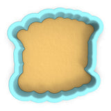 a cookie cutter with a cookie in the shape of a square