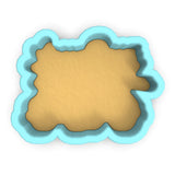 a cookie cutter with a cookie in the shape of a cloud