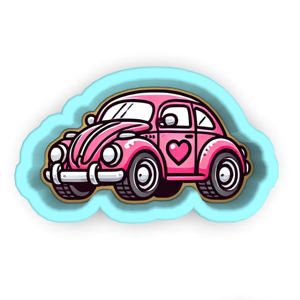 a pink car with a heart on the hood