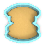 a cookie cutter with a cookie inside of it