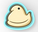 A cartoon pea-shaped cookie cutter in a blue and yellow color scheme.