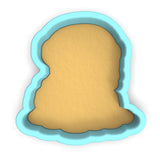 a cookie cutter with a cookie in the shape of a face