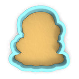 a cookie cutter with a cookie in the shape of a face