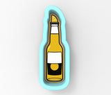 a bottle of beer with a lemon on top