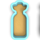 a cookie shaped like a bottle of milk
