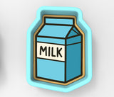 A blue and white cookie cutter shaped like a carton of milk.