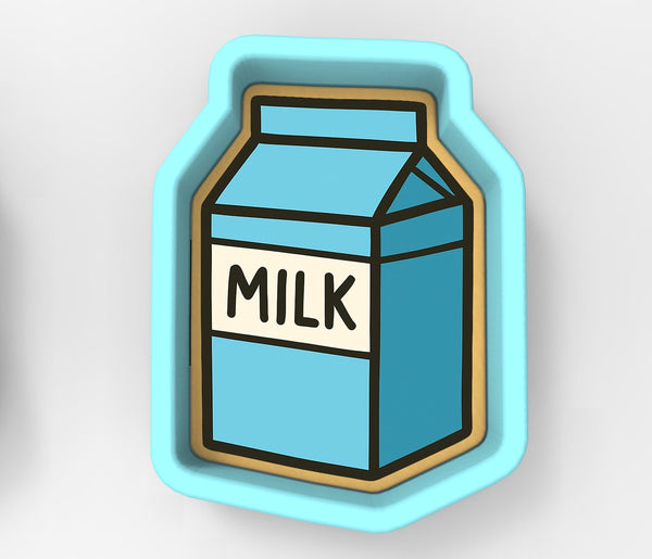 A blue and white cookie cutter shaped like a carton of milk.
