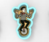 a picture of a man riding a unicycle
