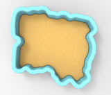 A 3D rendering of a light blue shape resembling a map or a coastline, with a sandy or beige color.