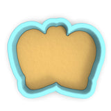 a cookie cutter with a cookie in the shape of a heart