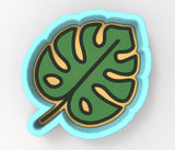 A 3D rendering of a green leaf with yellow outlines, set against a light blue background.