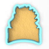 a cookie cutter with the shape of a castle