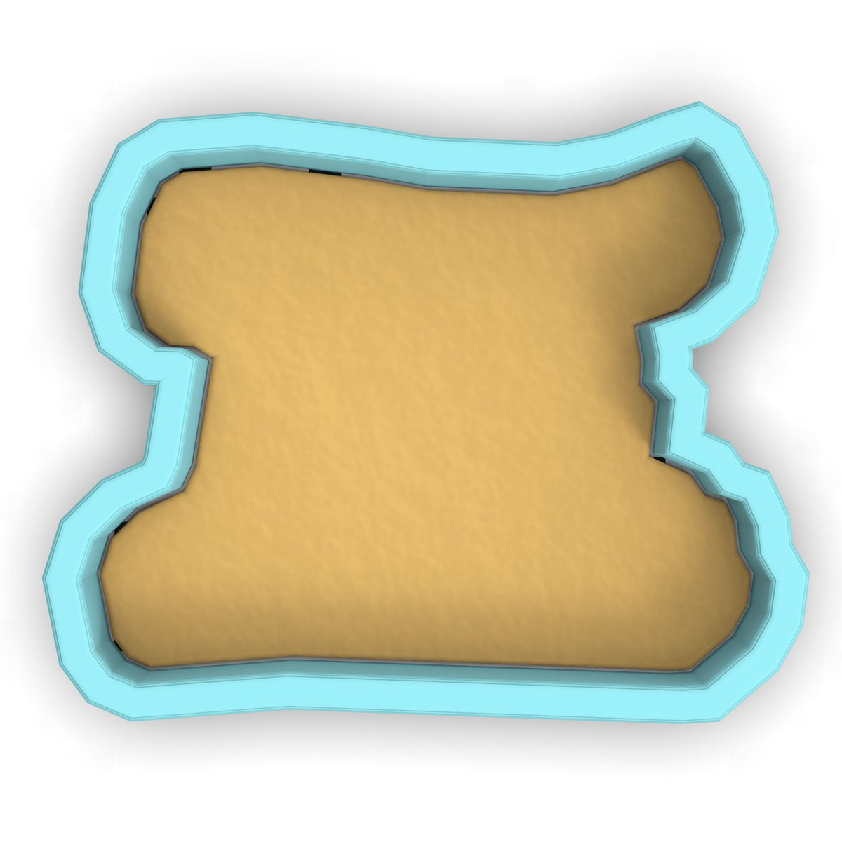 a cookie cutter with a cookie shaped like a bone