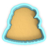 a cookie cutter with a cookie in the shape of a tree