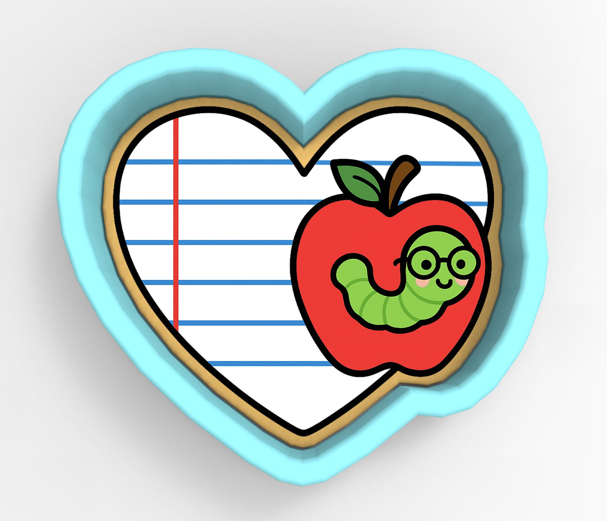 A heart-shaped cookie cutter with a red apple and a green caterpillar on it, set against a background of lined paper.