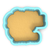 a cookie cutter with a cookie in the shape of a letter g