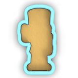 a cookie shaped like a cross on a white background