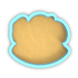 a cookie cutter with a cookie in the shape of a cookie