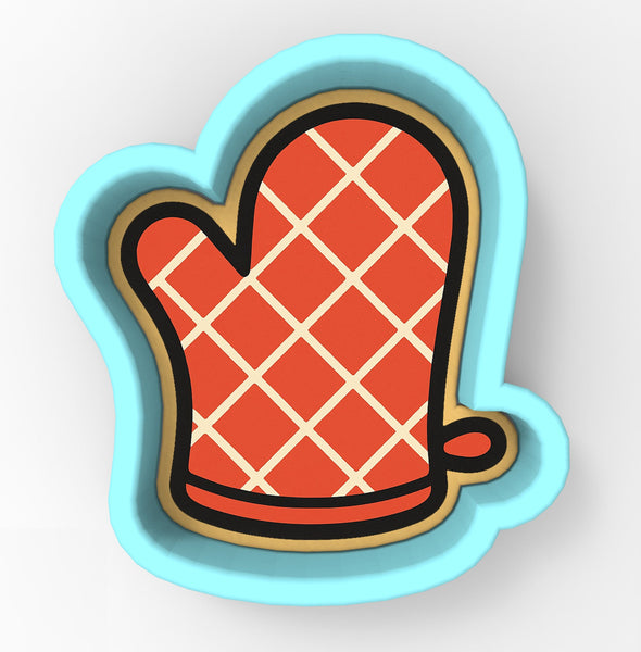 A red and white checkered pattern on a blue cookie cutter.