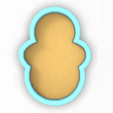 a cookie cutter with a cookie in the shape of a face