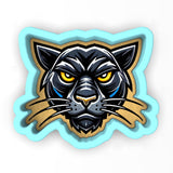 a sticker of a black cat with yellow eyes