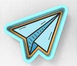 A blue and gold paper airplane cookie cutter.