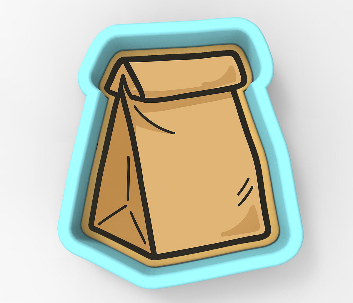 A cookie cutter in the shape of a brown paper bag.