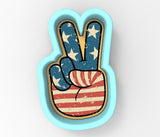 a peace sign painted in the colors of the american flag