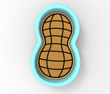 a cookie shaped cookie cutter with a design on it