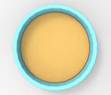 A blue bowl filled with a yellow substance, possibly a sauce or batter, is shown in the image.