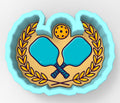 A 3D rendering of a paddleball logo, featuring two blue paddleboards crossed in an X shape, a yellow tennis ball, and a laurel wreath.