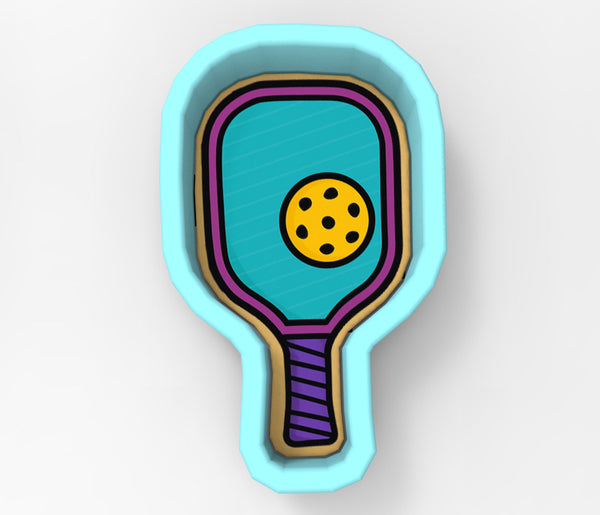 A blue paddle with a yellow ball on it, depicted in a 3D rendering.