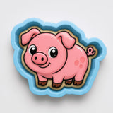 A pink pig cookie cutter with a blue border.