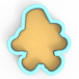 a cookie cutter with a cookie shaped like a bear