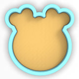 a cookie shaped like a mickey mouse head