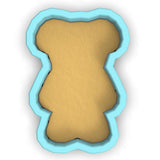 a cookie cutter with a cookie shaped like a man