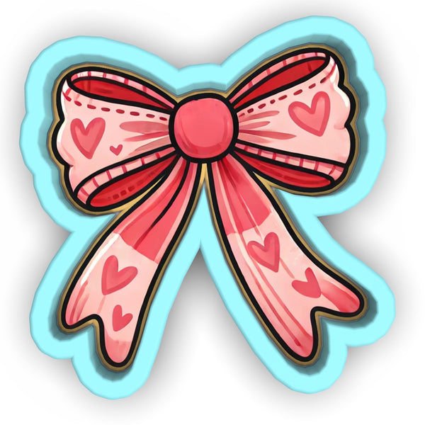 a pink bow with hearts on it