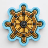 a ship's steering wheel, which is a decorative piece with a blue and brown color scheme.