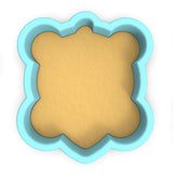 a cookie cutter with a cookie in the shape of a bear