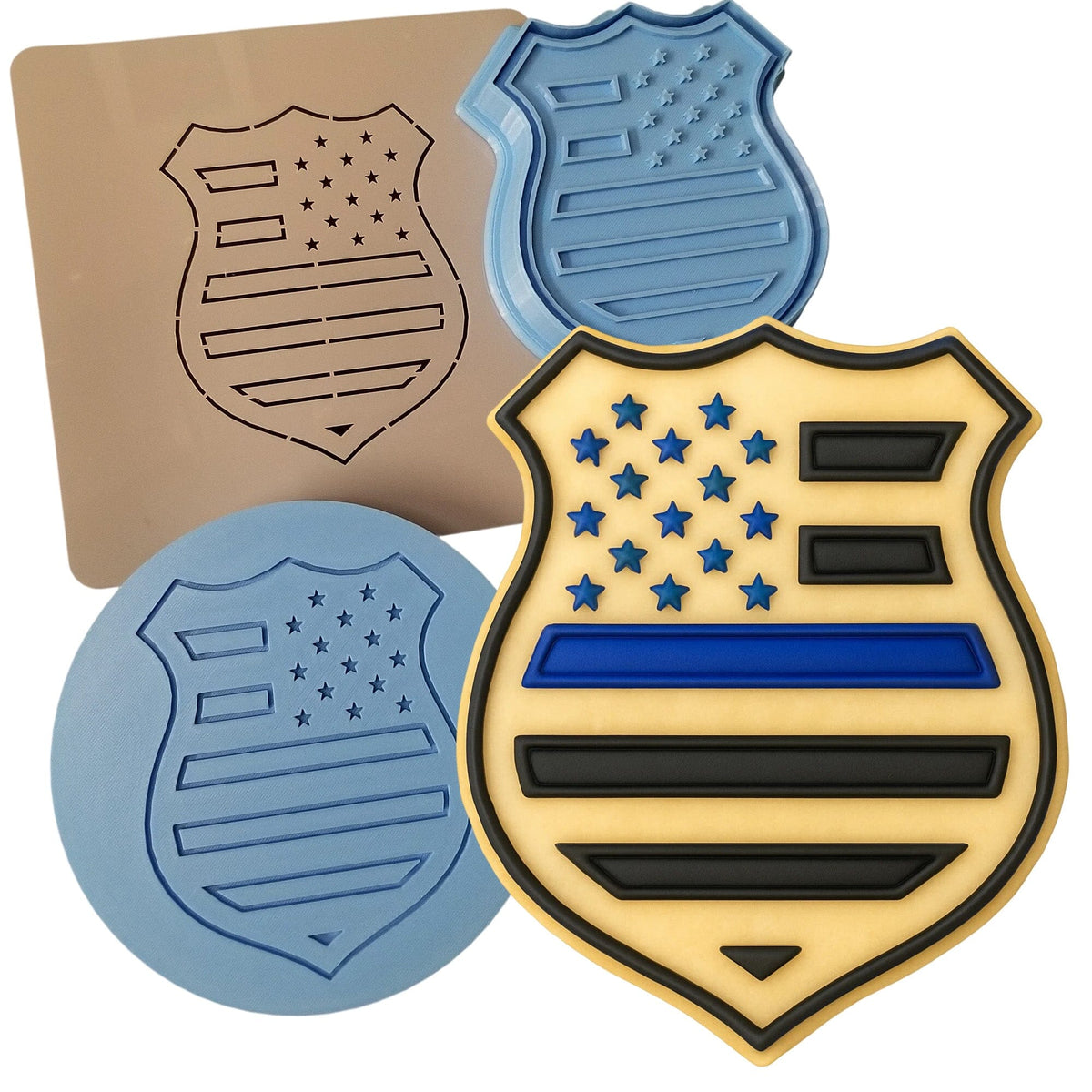 three cookie molds of different shapes and sizes