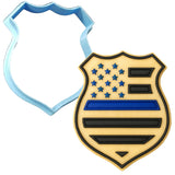 a cookie cutter shaped like a police badge