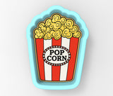 a popcorn box with a popcorn on top of it
