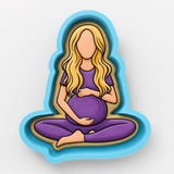 A cartoon illustration of a pregnant woman sitting cross-legged with a baby on her lap.