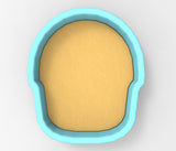 A blue bowl with a yellow substance inside it.