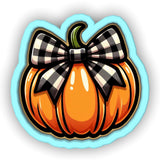 a sticker of a pumpkin with a bow on it