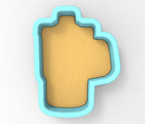 A blue cookie cutter in the shape of a heart.