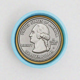A United States quarter dollar coin with a blue rim, featuring the profile of George Washington.
