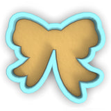 a cookie shaped like a butterfly on a white background